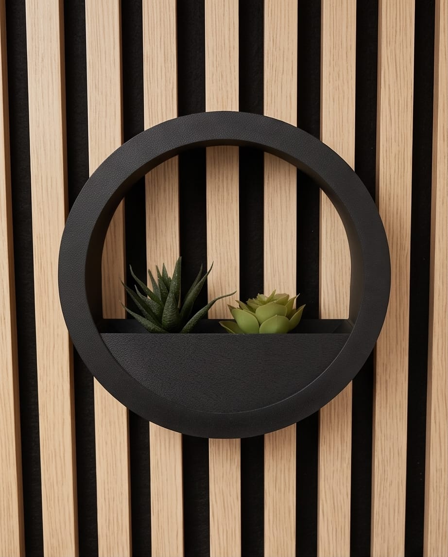 Black Orbis wall planter styled on a wooden slat wall